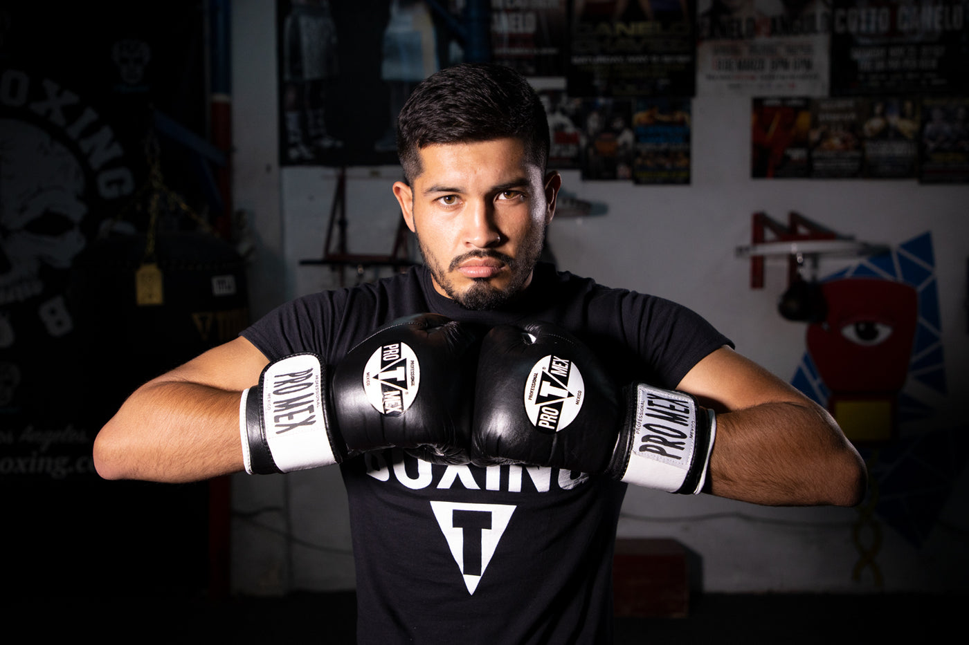 variant:Black::Pro Mex Professional Bag Gloves V3.0 man posing in gloves
