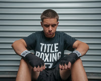 variant:lifestyle::Pro mex Official Meixcan Style 140" Hand Wraps 2.0 sitting on the ground