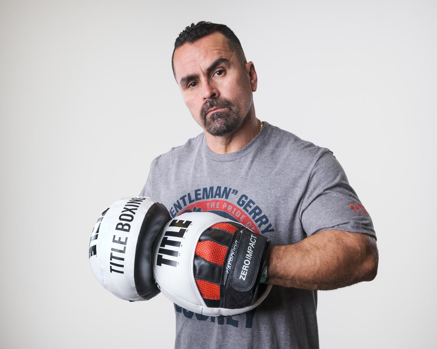 variant:lifestyle::TITLE Boxing Zero-Impact "Rare Air" Punch Mitts 2.0 hands together