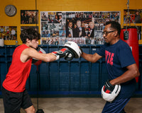 variant:lifestyle::TITLE Boxing Zero-Impact "Rare Air" Punch Mitts 2.0 mitting with coach