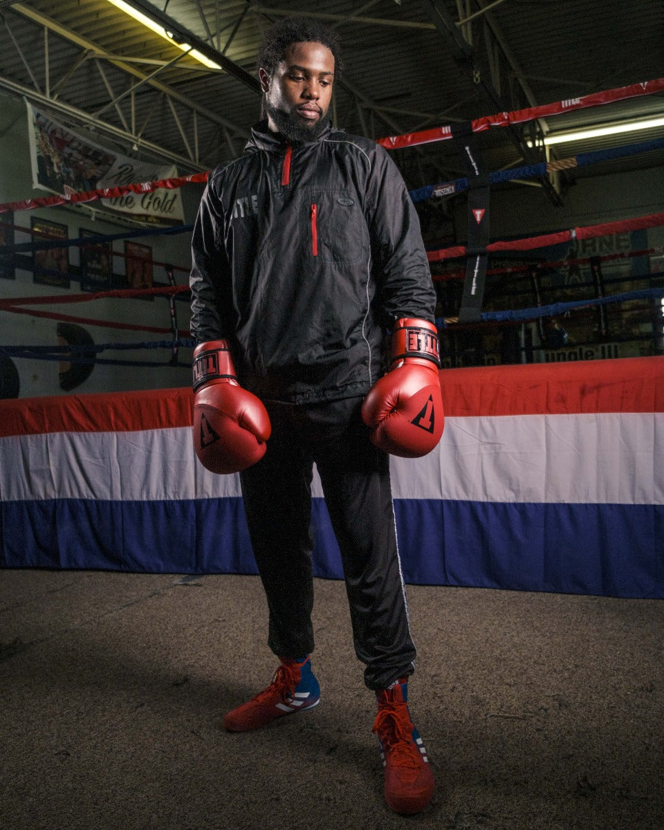 variant:lifestyle::TITLE Platinum Prevail Rubberized Sauna Suit main view gloves on hands down