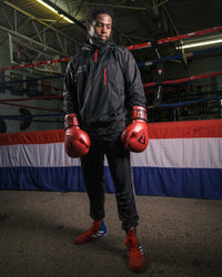 variant:lifestyle::TITLE Platinum Prevail Rubberized Sauna Suit main view gloves on hands down