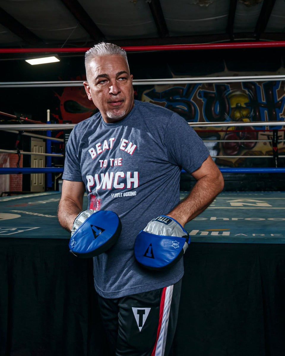 variant:lifestyle::TITLE Platinum Perilous Micro Palm Mitts guy posing with punch mitts