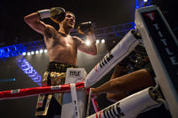 variant:lifestyle::TITLE Boxing Ring Turnbuckle Covers man standing on ring post