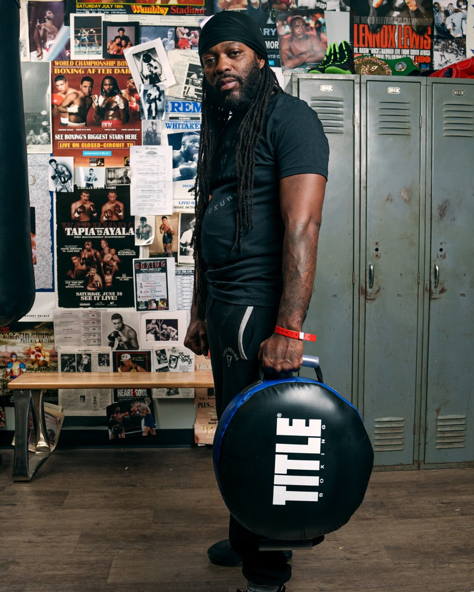 variant:lifestyle::TITLE Boxing Round Punch Shield coach holding down