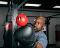variant:lifestyle::TITLE Boxing Quick Puncher 2.0 boxer punching the ball