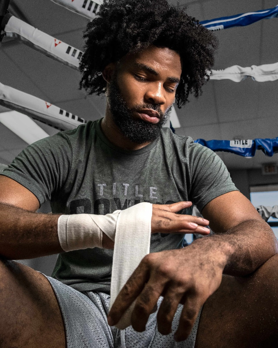 variant:lifestyle::TITLE Boxing Mexican Style Elastic Wraps with a boxer using them