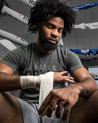 variant:lifestyle::TITLE Boxing Mexican Style Elastic Wraps with a boxer using them