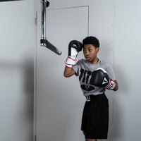 variant:lifestyle::TITLE Boxing Rapid-Reflex Bar side view of a boxer using the bar