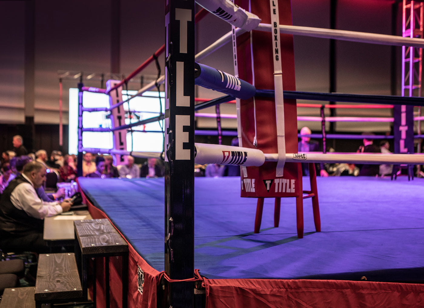 variant:lifestyle::TITLE Boxing Professional Ring Stairs in use on a boxing ring