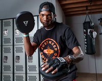 variant:lifestyle::TITLE Boxing Razor Punch Mitts 2.0 guy posing with punch mitts