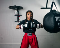variant:lifestyle::TITLE Fold-Away Adjustable Speed Bag Platform 2.0 girl infront of platform