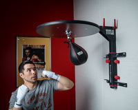 variant:lifestyle::TITLE Fold-Away Adjustable Speed Bag Platform 2.0 guy punching speedbag