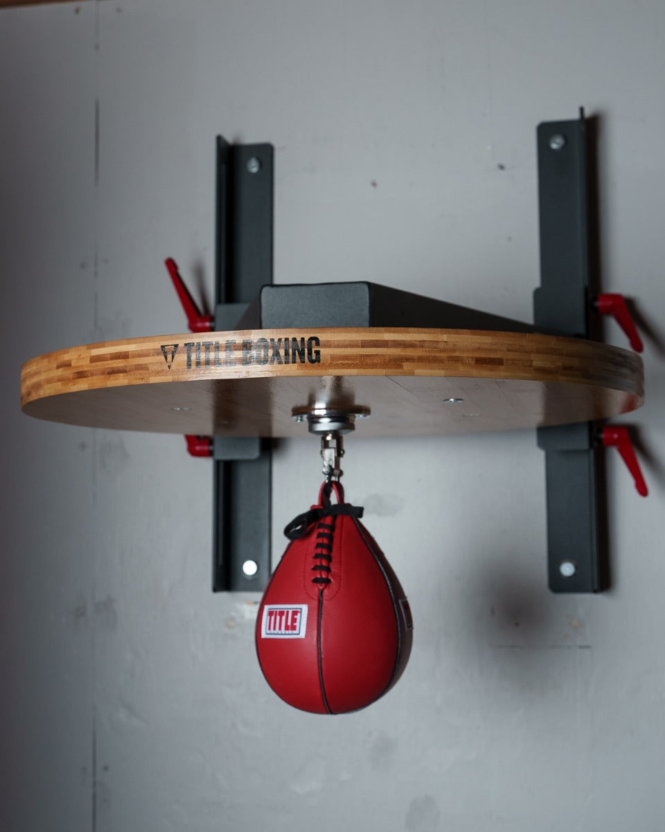 variant:lifestyle::TITLE Forged Steel Adjustable Pro Speed Bag Platform swivel hanging from platform front view