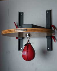 variant:lifestyle::TITLE Forged Steel Adjustable Pro Speed Bag Platform swivel hanging from platform front view