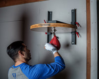 variant:lifestyle::TITLE Forged Steel Adjustable Pro Speed Bag Platform guy hitting speed bag