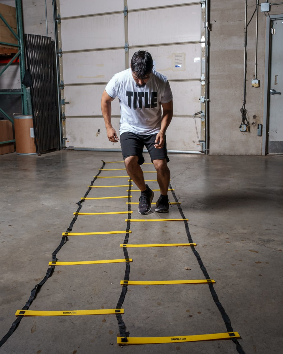 variant:lifestyle::TITLE Boxing Double Speed & Agility Ladder 2.0 in use in a boxing gym