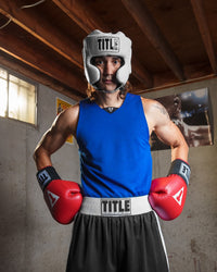 variant:lifestyle::TITLE Boxing Superior Lightweight Reversible Competition Jersey man posing with gloves