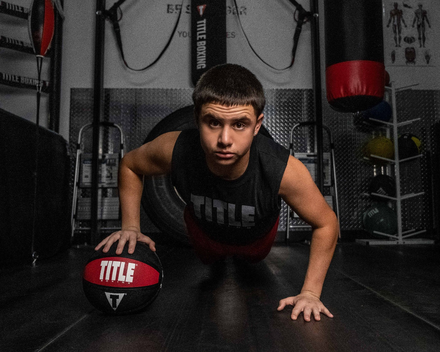 variant:6 lbs::TITLE Boxing Rubber Medicine Ball kid doing a push up with ball