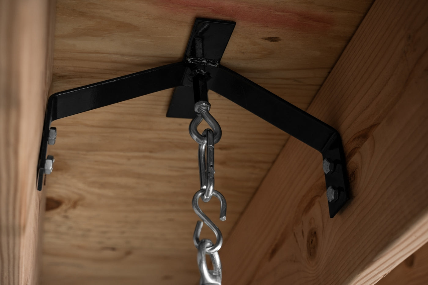 variant:lifestyle::TITLE Boxing Rafter Heavy Bag Hanger in use in a boxing gym