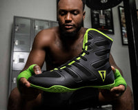 variant:Black/Neon Green::TITLE Boxing Total Balance Shoes  man holding shoes