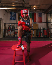 variant:Red/Black::TITLE Boxing Speed-Flex Encore Mid-Top Shoes boy posing in shoes
