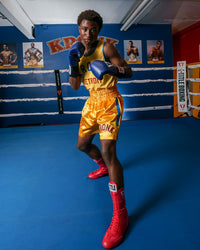 variant:Red::TITLE Boxing Speed-Flex Encore High-Top Shoes man posing in shoes