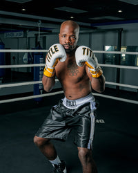 variant:black/white::TITLE Boxing Edge Boxing Trunks 2.0 guy stance in ring