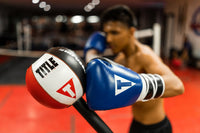 variant:Black/White/Red::TITLE Boxing Deluxe King Cobra Reflex Bag blue gloves