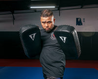 variant:lifestyle::TITLE Classic Pro Leather Thai Pads 3.0 (pair) coach with thai pads