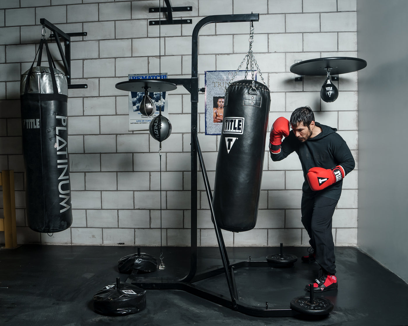 variant:lifestyle::TITLE Boxing Heavy Bag And Speed Bag Stand full view in a boxing gym