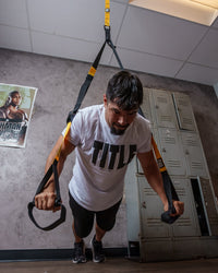 variant:lifestyle::TITLE Boxing Suspension Training System 2.0 in use in a boxing gym