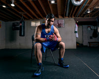 variant:USA::TITLE Boxing Velpeau Amateur Competition 177" Wraps man posing in chair with hands wrapped