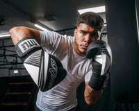 variant:Black/White::Viper by TITLE Boxing Strike Select Bag Gloves 2.0 man posing in gloves