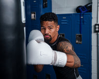 variant:lifestyle::TITLE White Boxing Lace Sparring Gloves 2.0 man wearing white gloves posing