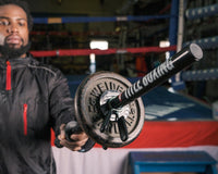 variant:lifestyle::TITLE Boxing Wrist Power Bar with weight on it