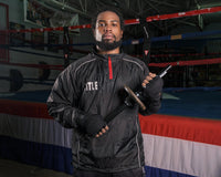 variant:lifestyle::TITLE Boxing Wrist Power Bar in a boxing gym