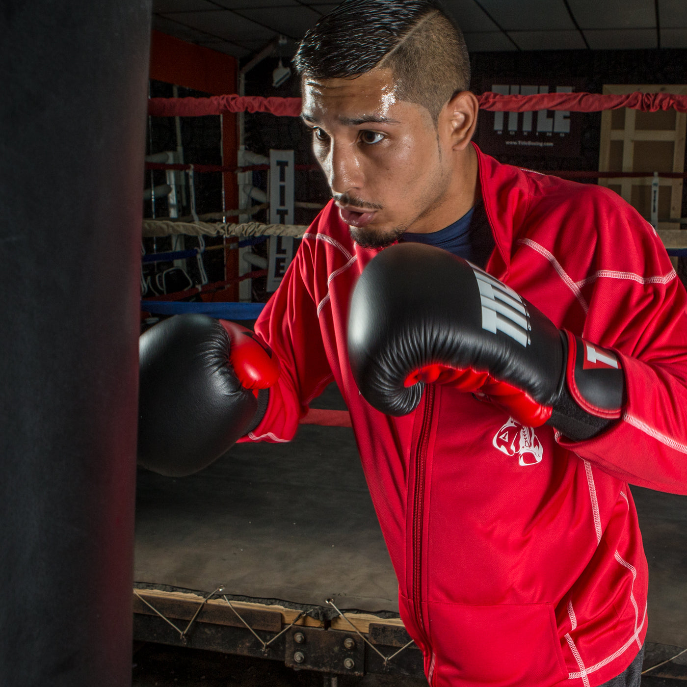 variant:Black/Red::TITLE Boxing Dynamic Strike Heavy Bag Gloves man posing in gloves