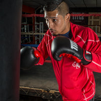variant:Black/Red::TITLE Boxing Dynamic Strike Heavy Bag Gloves man posing in gloves