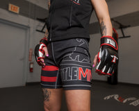 variant:Black/White/Red::TITLE MMA Conflict Pro Fight Gloves woman posing wearing gloves