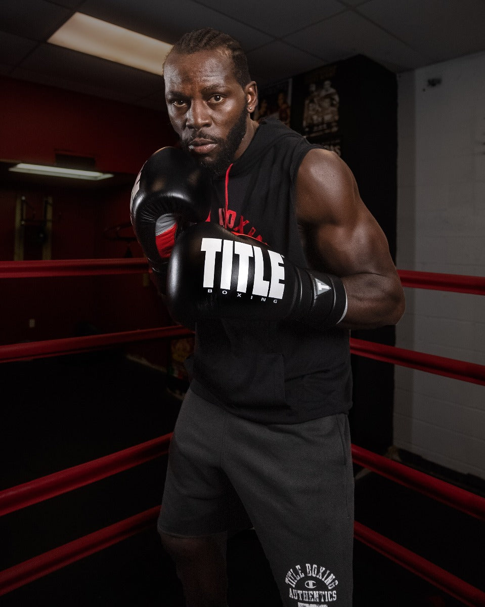 variant:Black/Silver::TITLE Boxing Leather Enforcer Pro Sparring Gloves man modeling gloves