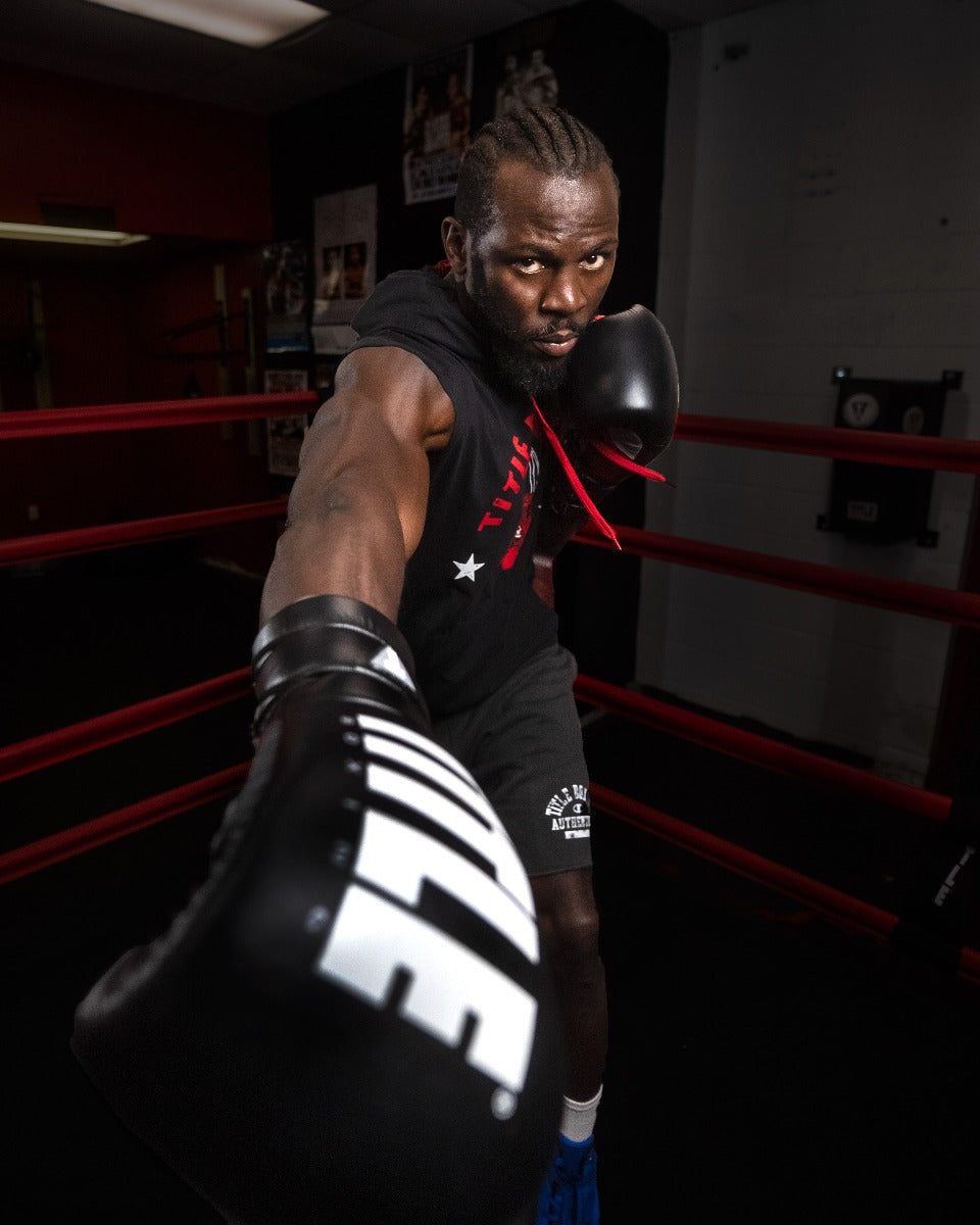 variant:Black/Silver::TITLE Boxing Leather Enforcer Pro Sparring Gloves man posing with gloves