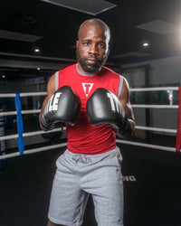 variant:Black/Silver::TITLE Boxing Leather Enforcer Pro Sparring Gloves man posing wearing gloves