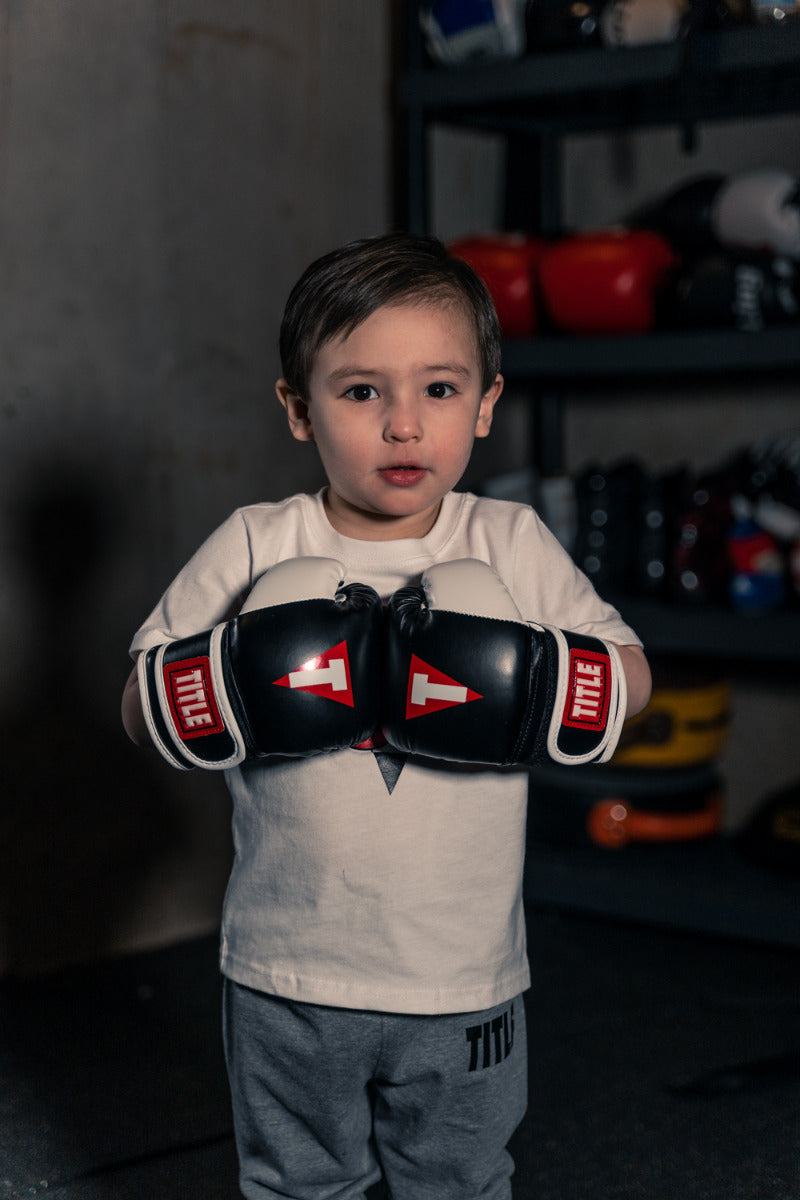 variant:Black/White::TITLE Boxing Youth Bag Gloves youth wearing gloves
