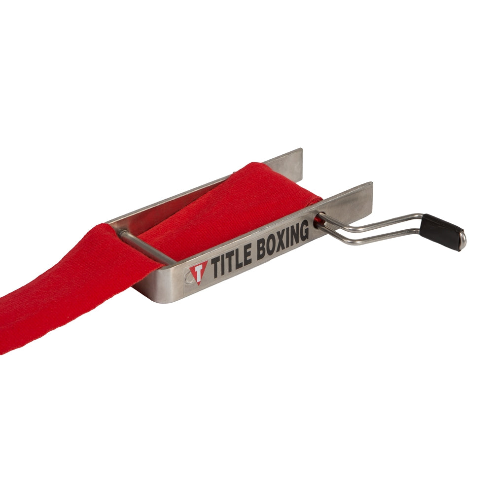 variant:lifestyle::TITLE Boxing Portable Zip Hand Wrap Roller in use with a red hand wrap