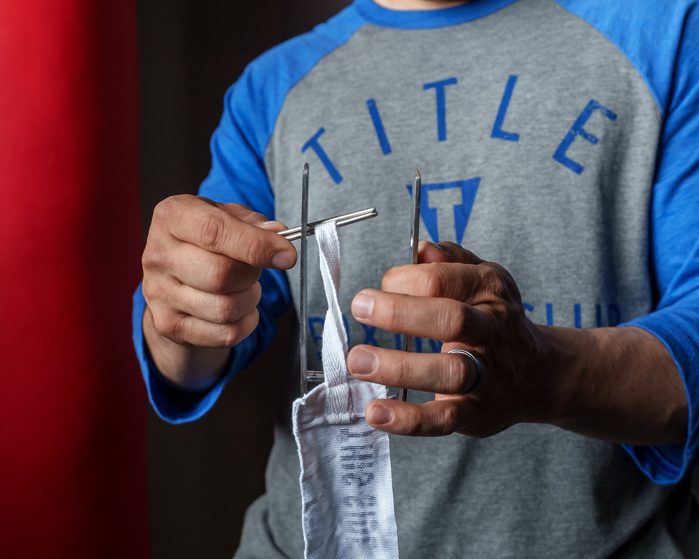 variant:lifestyle::TITLE Boxing Portable Zip Hand Wrap Roller how to insert the hand wrap loop