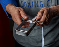 variant:lifestyle::TITLE Boxing Portable Zip Hand Wrap Roller close up